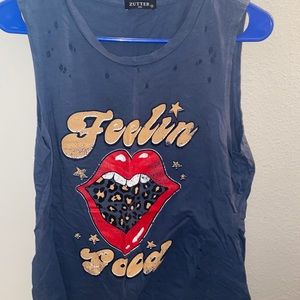 Blue tank top from a local boutique. It’s supposed to have holes and look worn.